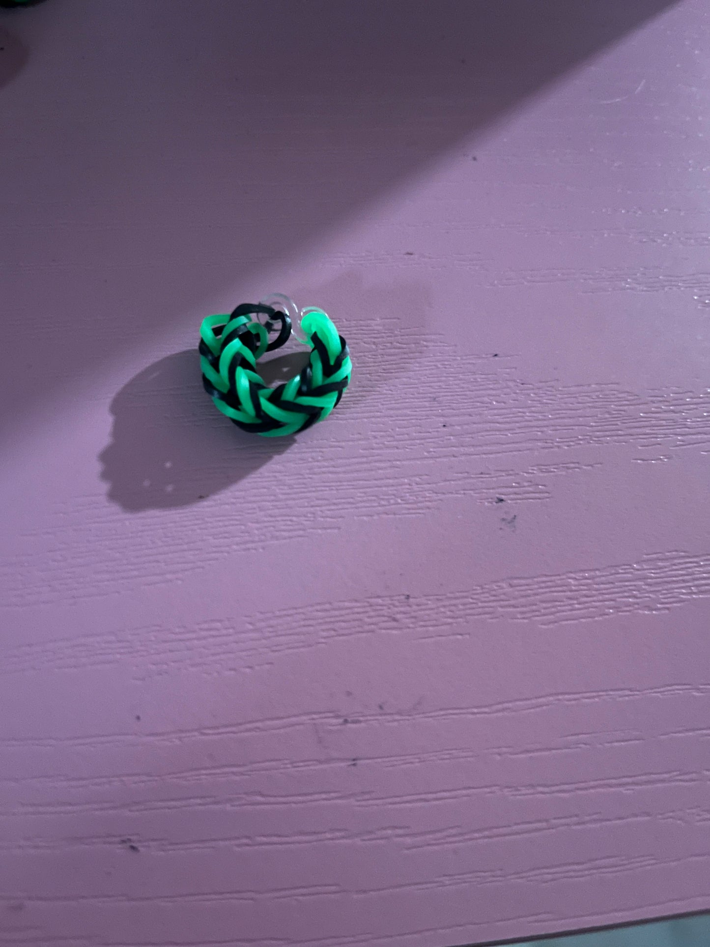 Green and black rubber band rings
