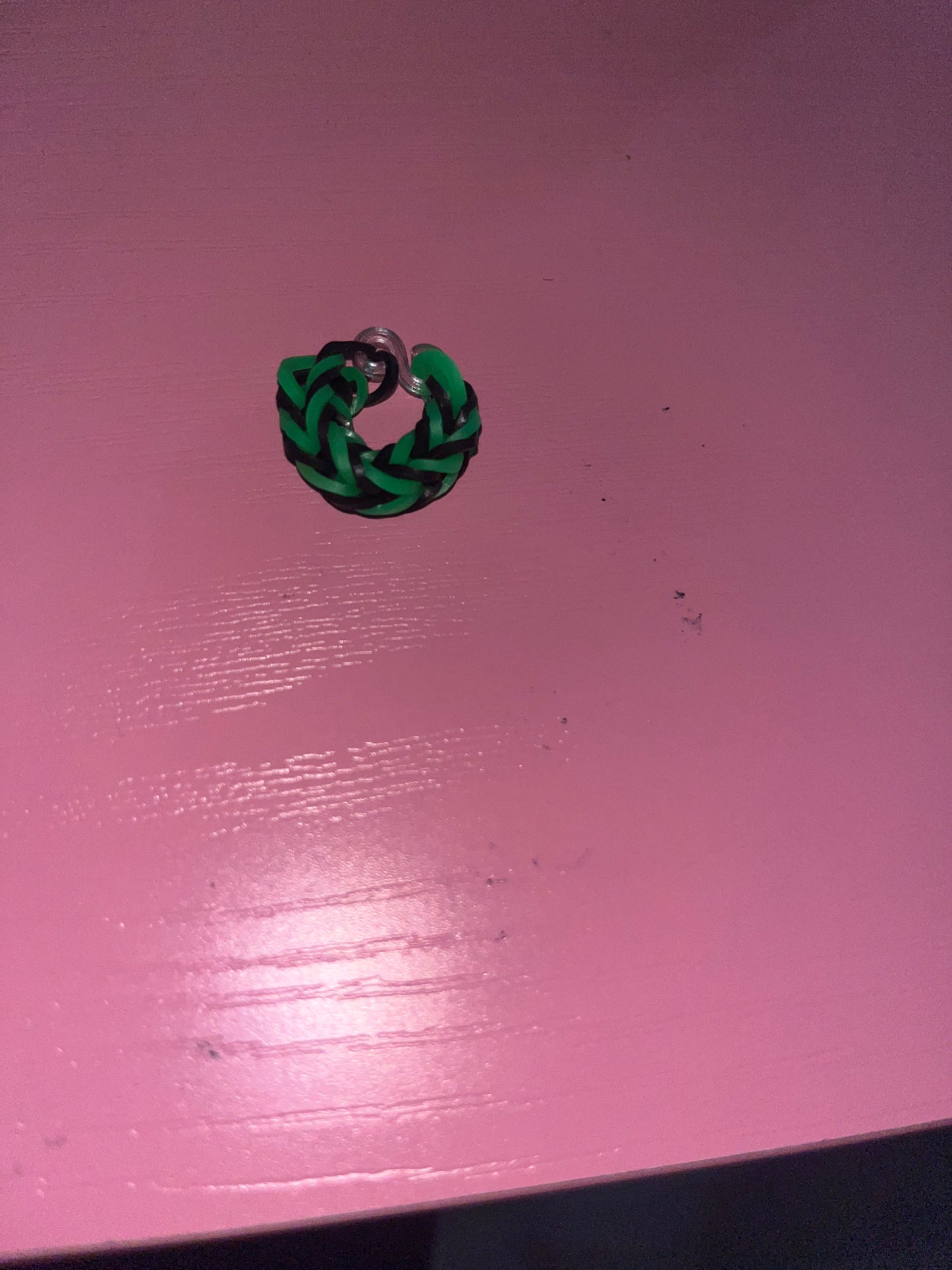 Green and black rubber band rings