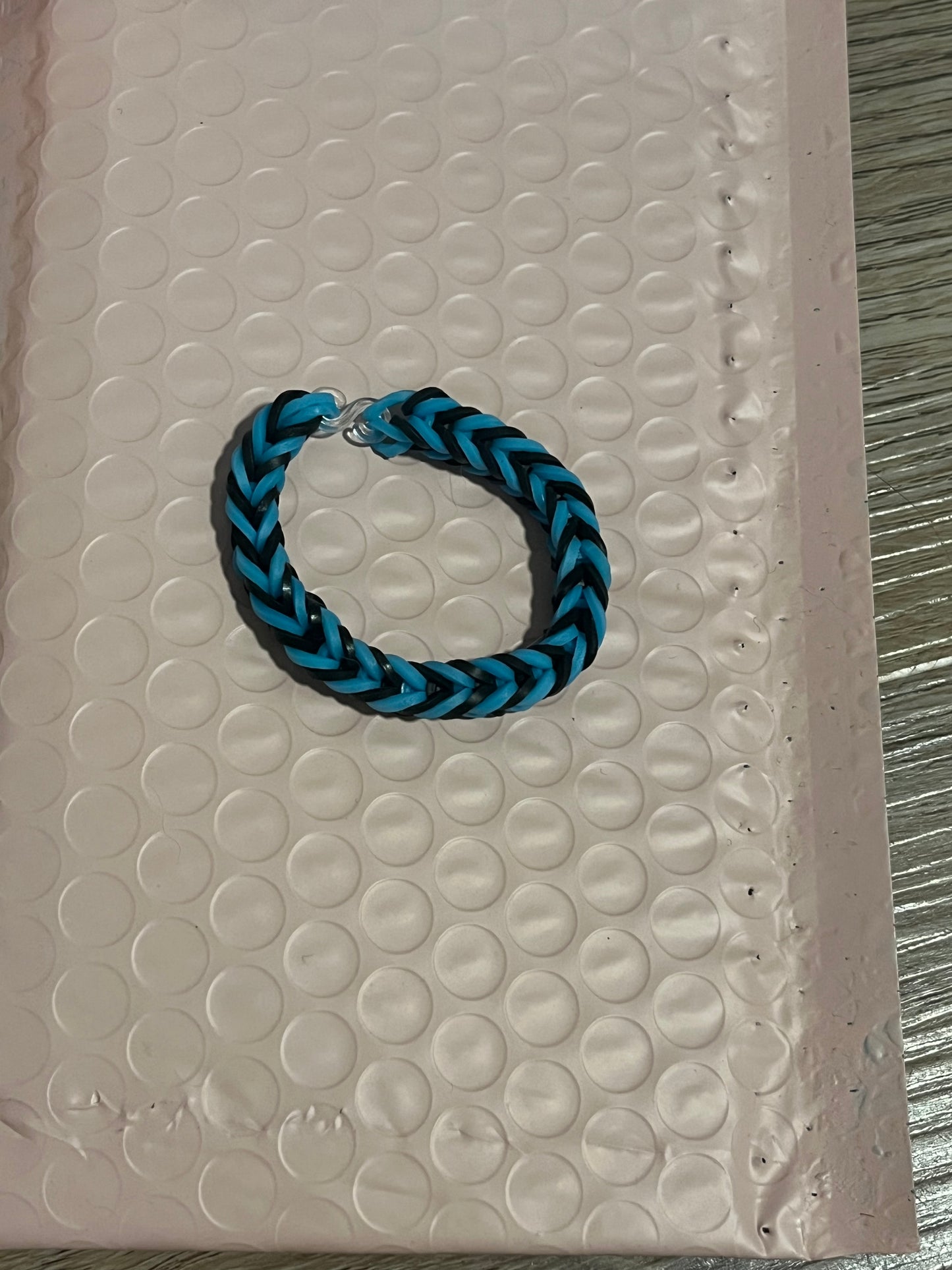 Black and light blue rubber band bracelets
