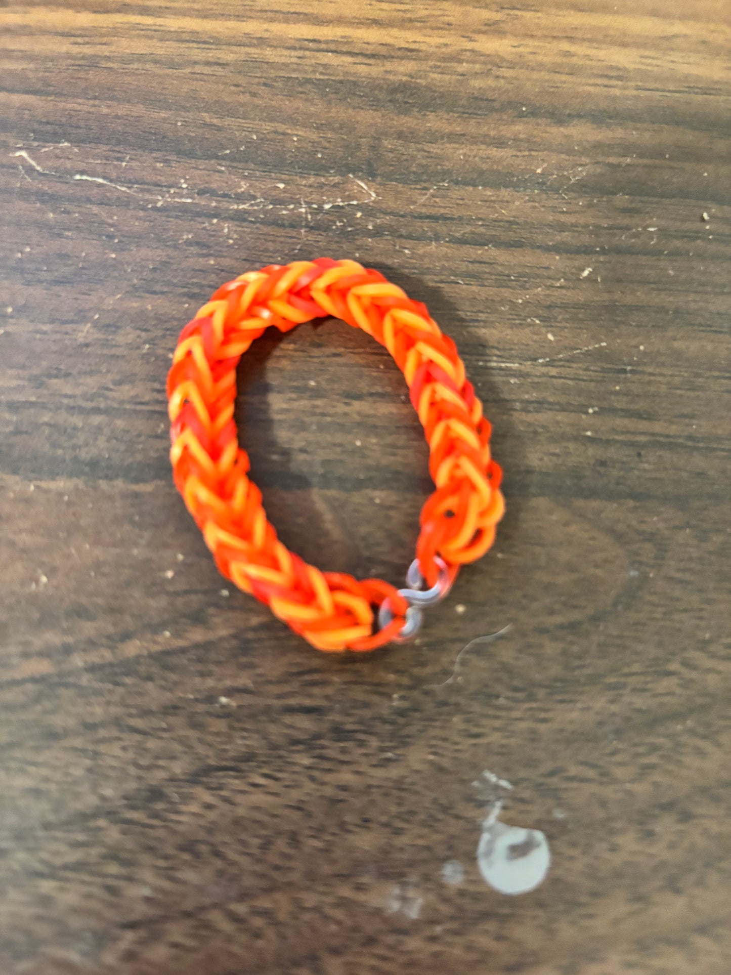 Red and orange rubber band bracelets