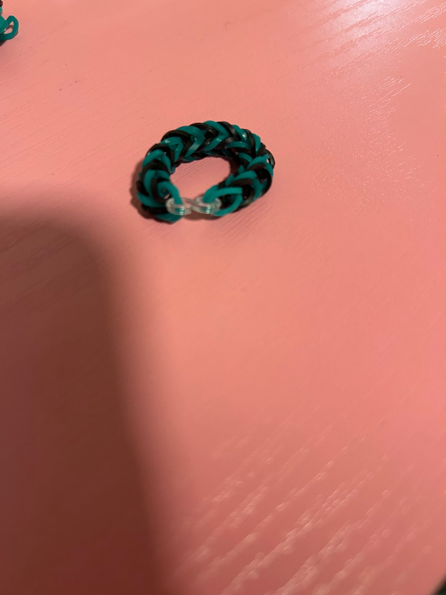 Dark green and black rubber band rings
