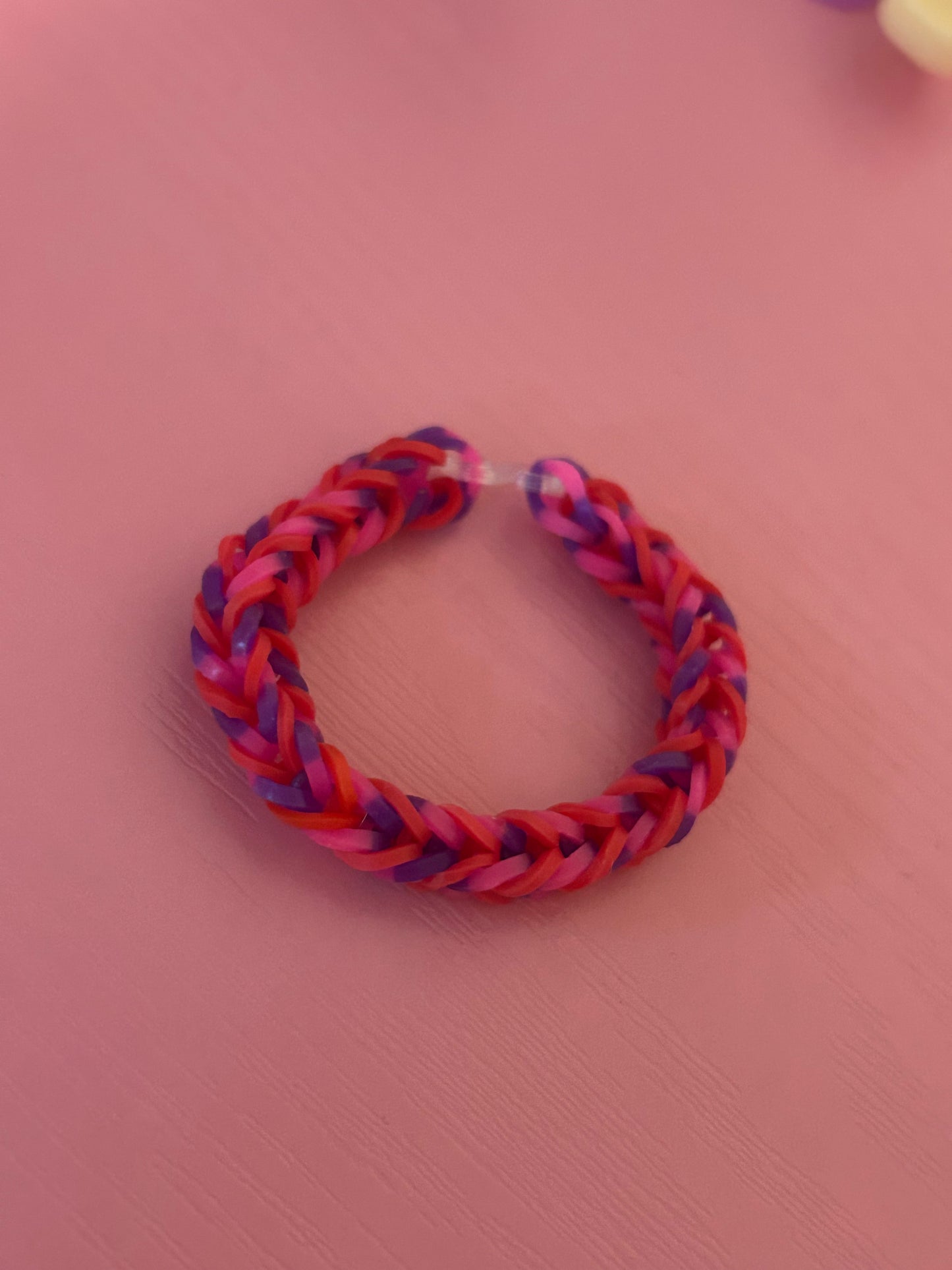 Red and pink/purple pattern rubber band bracelets