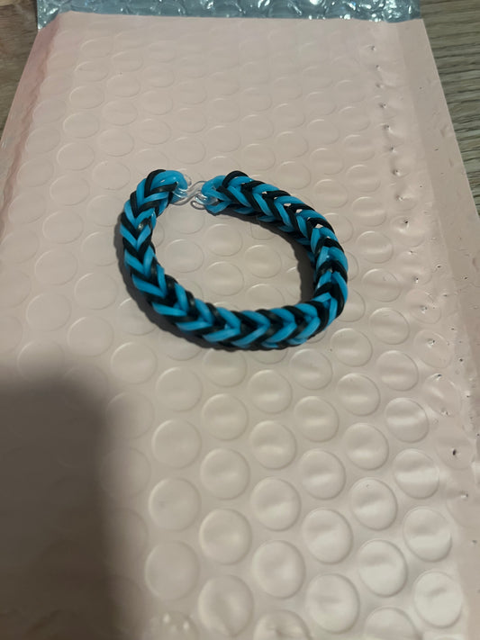 Black and light blue rubber band bracelets