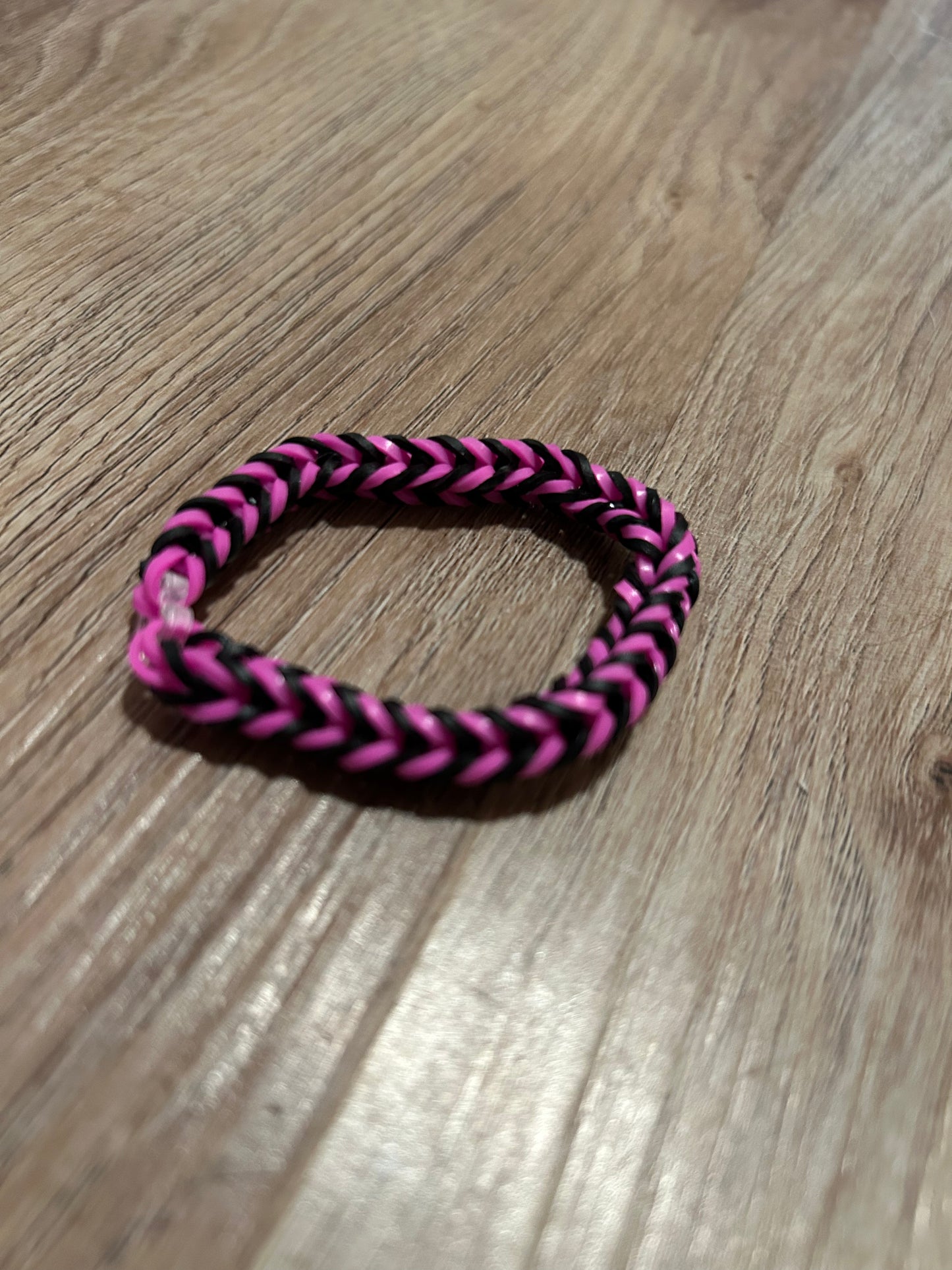 Pink and black rubber band bracelets